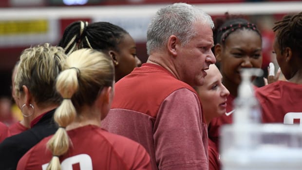 Razorbacks coach Jason Watson against Wisconsin at Barnhill Arena